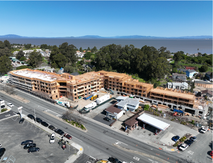 Building under construction, only the wood frame is currently erected.